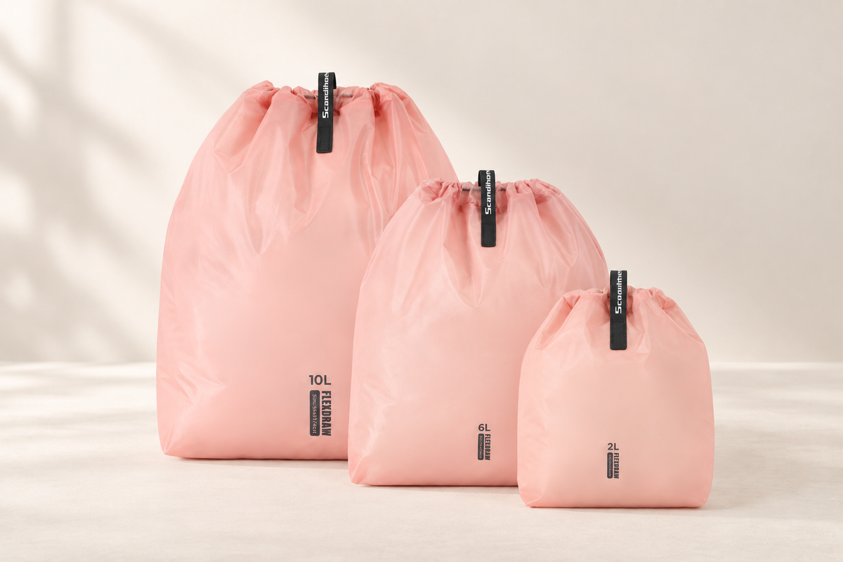 Three pink drawstring storage bags in different sizes